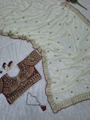 Premium off white saree with intricate embroidery & maroon heavy work blouse 4