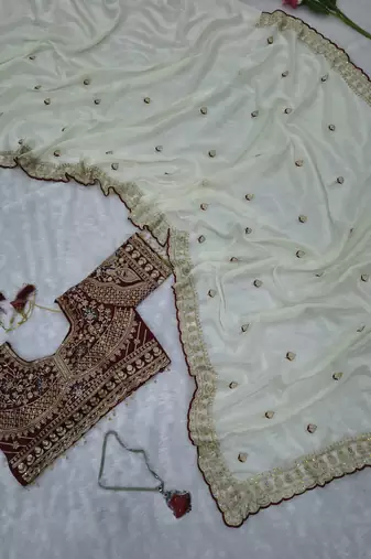 Premium off white saree with intricate embroidery & maroon heavy work blouse
