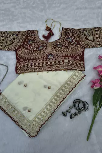 Premium off white saree with intricate embroidery & maroon heavy work blouse