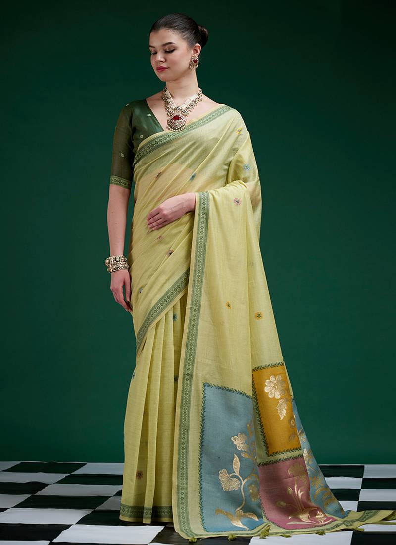 Olive handwoven saree with artistic floral patchwork pallu