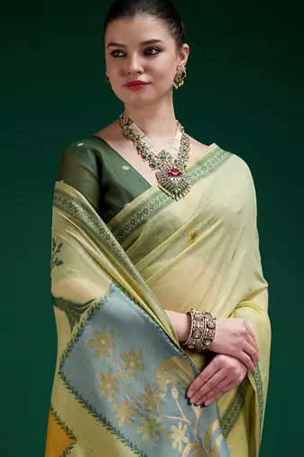 Olive handwoven saree with artistic floral patchwork pallu