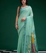 Turquoise handwoven saree with artistic floral patchwork pallu