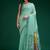 Turquoise handwoven saree with artistic floral patchwork pallu