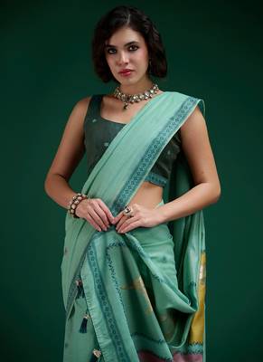 Turquoise handwoven saree with artistic floral patchwork pallu 2