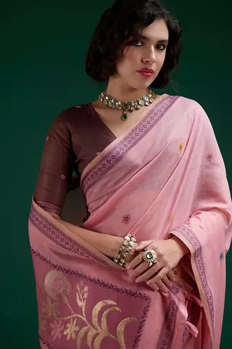 Pink handwoven saree with artistic floral patchwork pallu