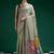 Sage green handwoven saree with artistic floral patchwork pallu
