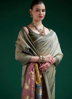 Sage green handwoven saree with artistic floral patchwork pallu 2
