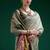 Sage green handwoven saree with artistic floral patchwork pallu
