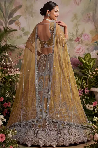 Dazzling Golden Multi Thread Work Net Reception Wear Lehenga Choli