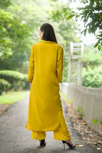 Women yellow premium crystal silk subtle chid and moti cutdana work on the collar and near the hemline kurta set