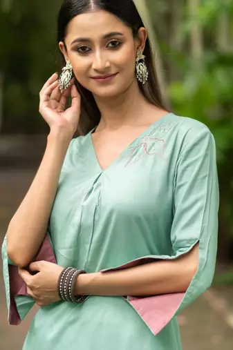 Women sea green premium crystal silk fine hand embroidery thread running stitch work on the neckline and hem kurta set