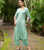 Women sea green premium crystal silk fine hand embroidery thread running stitch work on the neckline and hem, kurta set