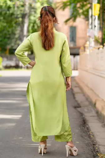 Women green premium crystal silk enhanced with fine sitara and thread work  kurta set