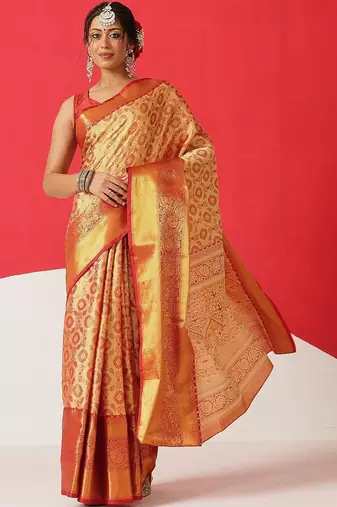 Golden woven silk blend ethnic saree with blouse piece