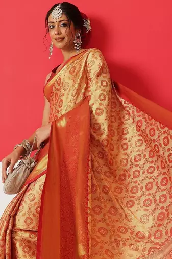 Golden woven silk blend ethnic saree with blouse piece