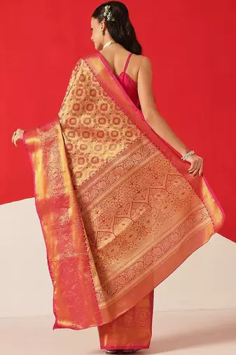 Golden woven silk blend ethnic saree with blouse piece