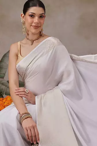 Off white woven silk blend ethnic saree with blouse piece