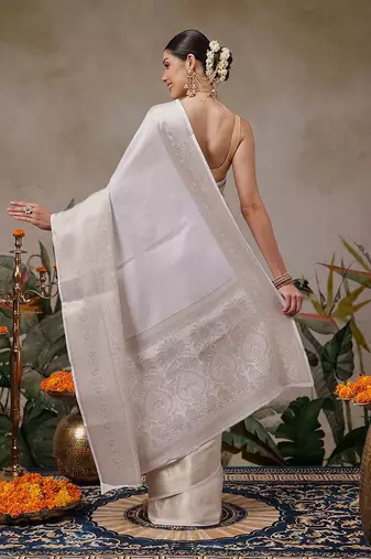 Off white woven silk blend ethnic saree with blouse piece