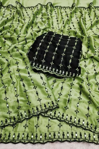 Stunning green viscose rangoli silk saree with black embroidery and mirror work