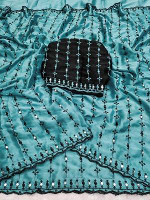 Stunning turquoise viscose rangoli silk saree with black embroidery and mirror work 2