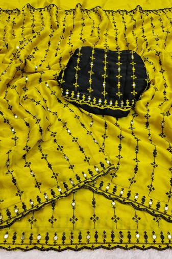 Stunning yellow viscose rangoli silk saree with black embroidery and mirror work