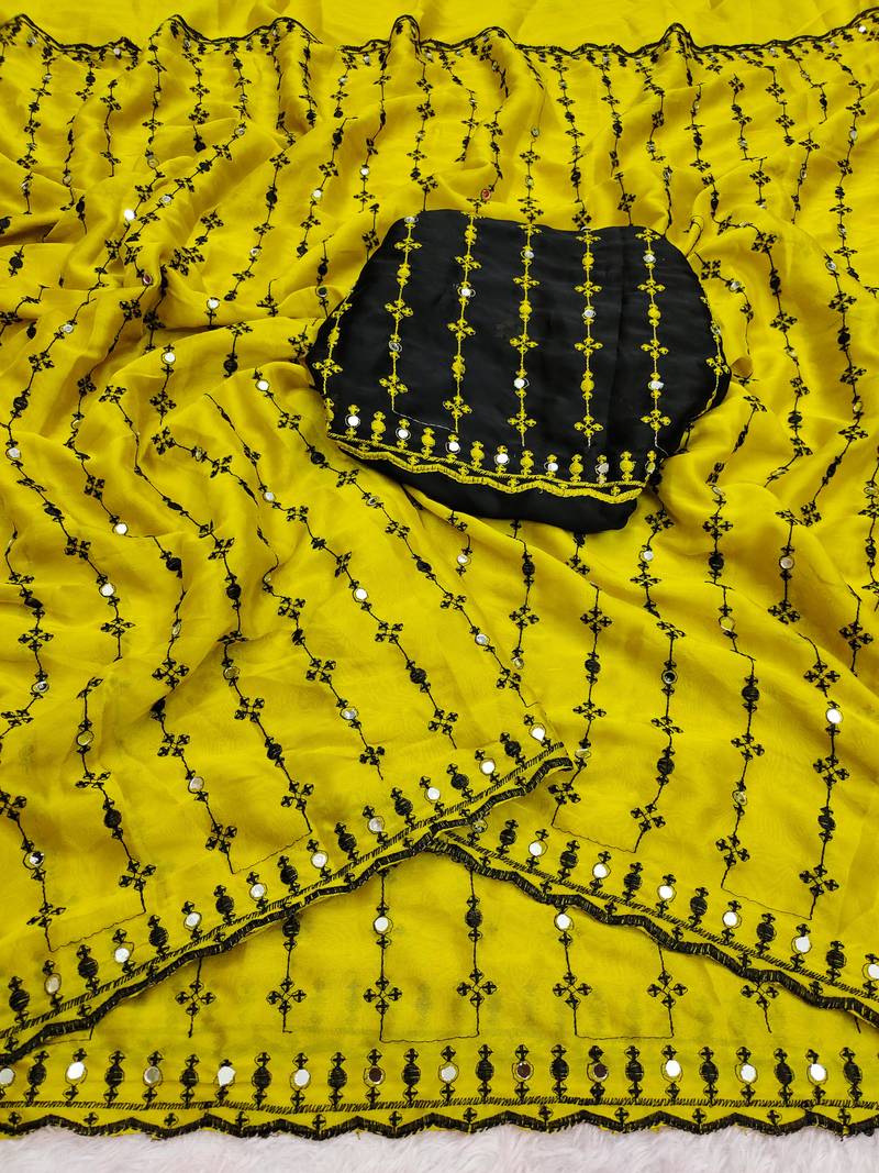 Stunning yellow viscose rangoli silk saree with black embroidery and mirror work
