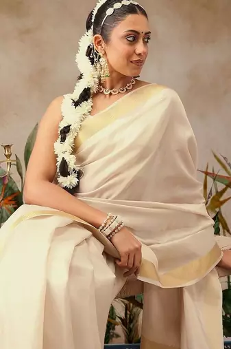 Off white plain silk blend ethnic saree with blouse piece