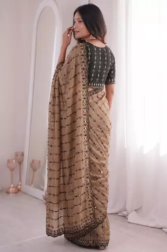 Stunning beige viscose rangoli silk saree with black embroidery and mirror work