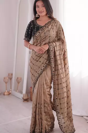 Stunning beige viscose rangoli silk saree with black embroidery and mirror work