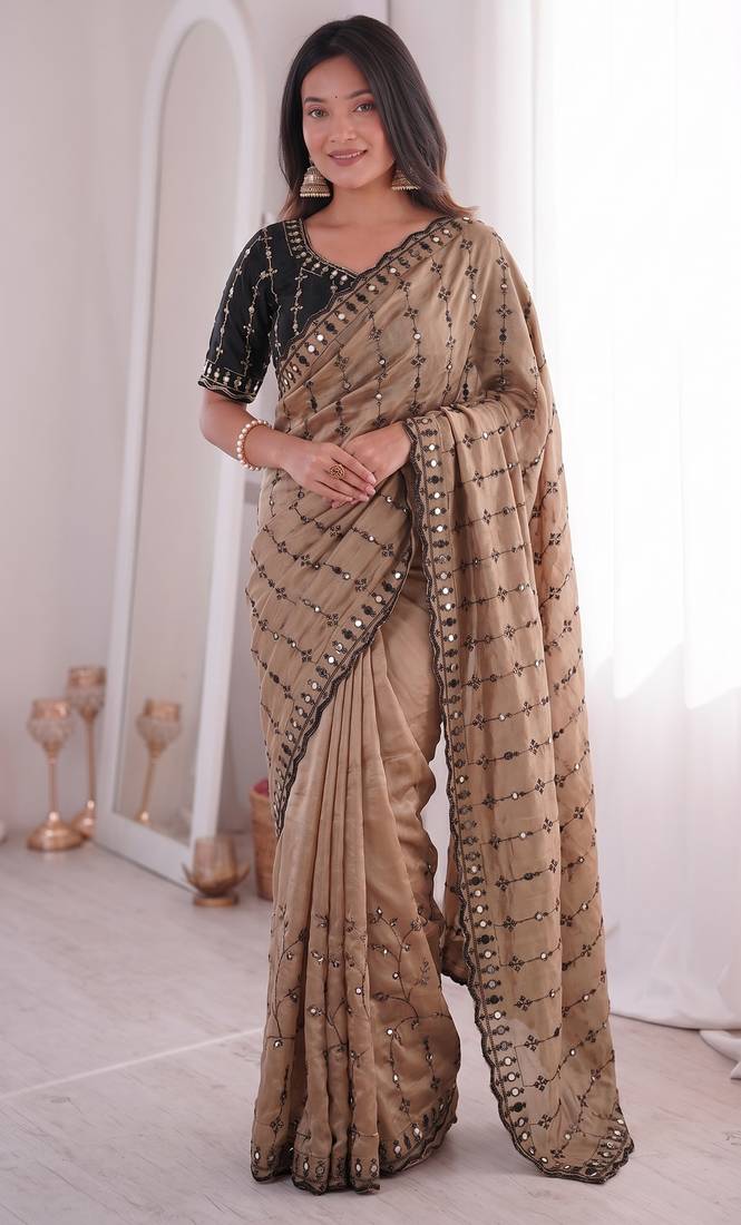 Stunning beige viscose rangoli silk saree with black embroidery and mirror work