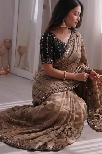 Stunning beige viscose rangoli silk saree with black embroidery and mirror work