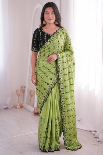 Stunning green viscose rangoli silk saree with black embroidery and mirror work