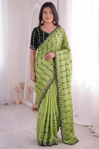 Stunning green viscose rangoli silk saree with black embroidery and mirror work