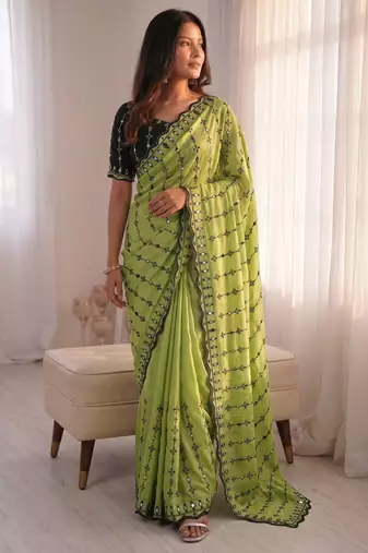 Stunning green viscose rangoli silk saree with black embroidery and mirror work