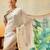 Off white printed art silk ethnic saree with blouse piece