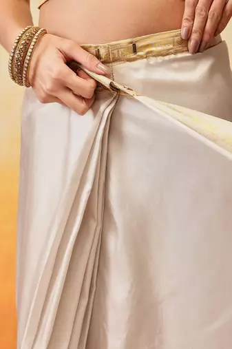 Off white printed art silk ethnic saree with blouse piece