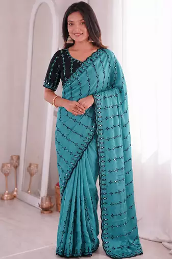 Stunning turquoise viscose rangoli silk saree with black embroidery and mirror work