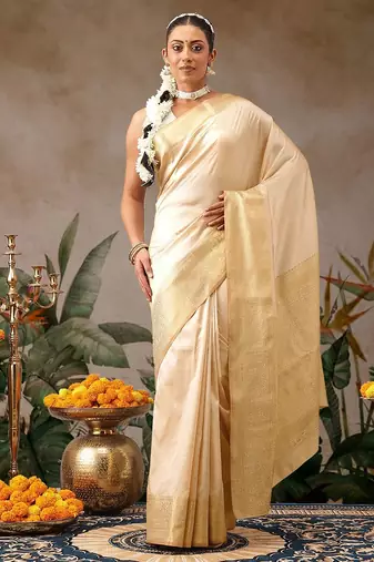 Cream woven silk blend ethnic saree with blouse piece