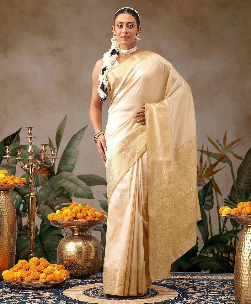 Cream woven silk blend ethnic saree with blouse piece