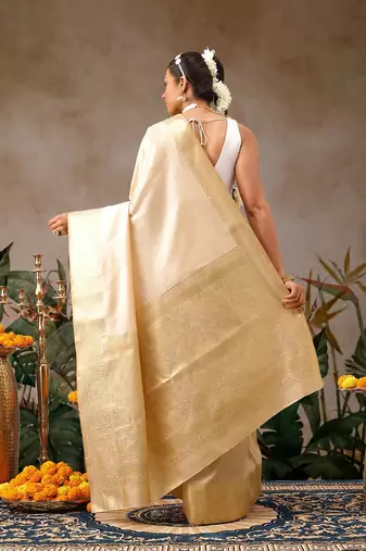 Cream woven silk blend ethnic saree with blouse piece