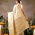 Cream woven silk blend ethnic saree with blouse piece