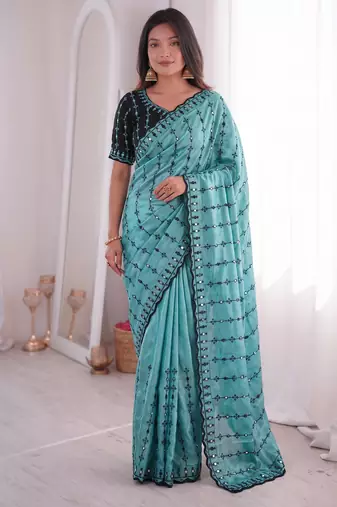 Stunning turquoise viscose rangoli silk saree with black embroidery and mirror work