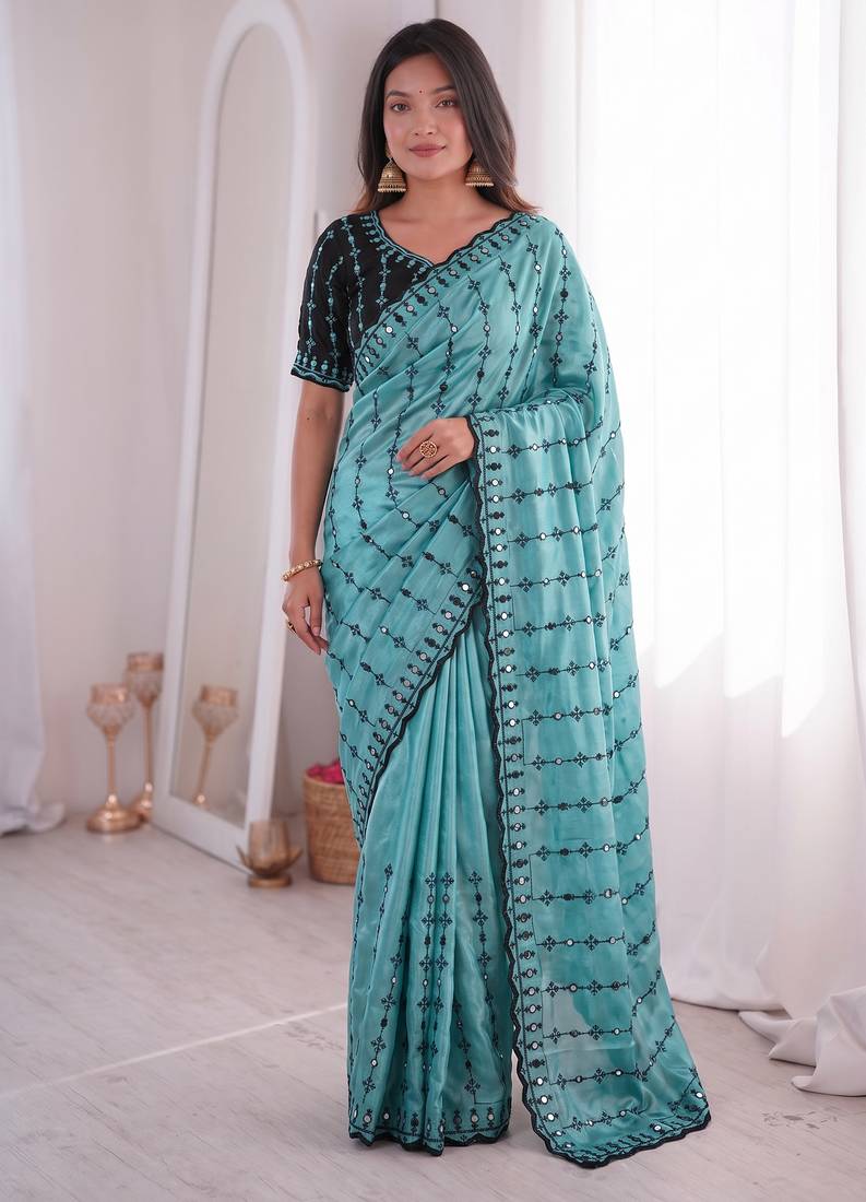 Stunning turquoise viscose rangoli silk saree with black embroidery and mirror work