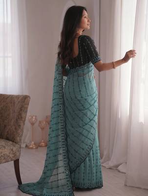 Stunning turquoise viscose rangoli silk saree with black embroidery and mirror work 4
