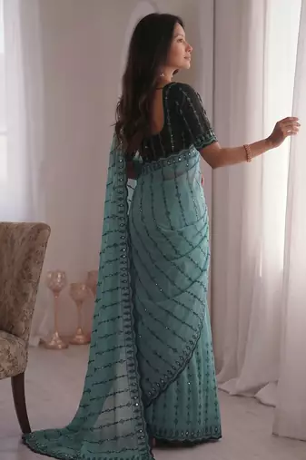 Stunning turquoise viscose rangoli silk saree with black embroidery and mirror work