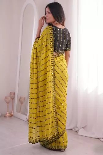 Stunning yellow viscose rangoli silk saree with black embroidery and mirror work