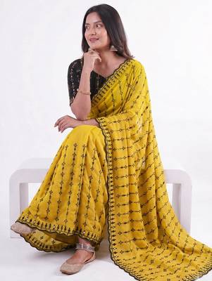 Stunning yellow viscose rangoli silk saree with black embroidery and mirror work 4