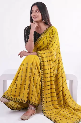 Stunning yellow viscose rangoli silk saree with black embroidery and mirror work