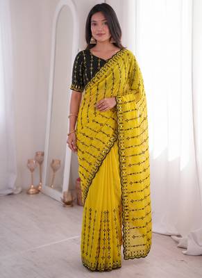 Stunning yellow viscose rangoli silk saree with black embroidery and mirror work 1
