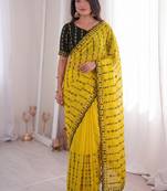Stunning yellow viscose rangoli silk saree with black embroidery and mirror work